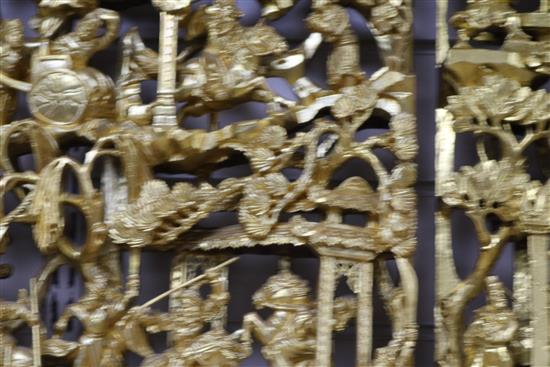 Six Chinese carved giltwood panels of soldiers amid pavilions